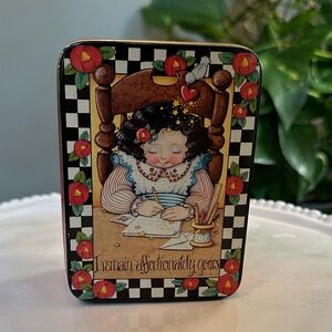 Mary Engelbreit Tin with Red and Black Checkered Design